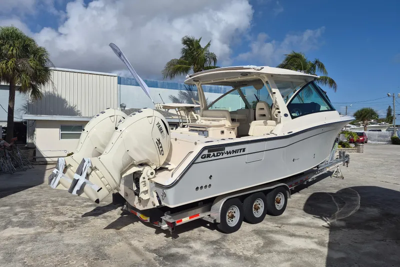 Slide: The Image of 2026 Grady-White Freedom 345 boat with dual Yamaha engines on a trailer. - 5