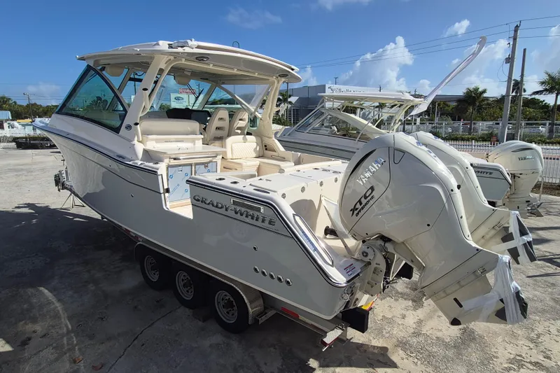 Slide: The Image of 2026 Grady-White Freedom 345 boat with Yamaha engines, parked outdoors. - 6