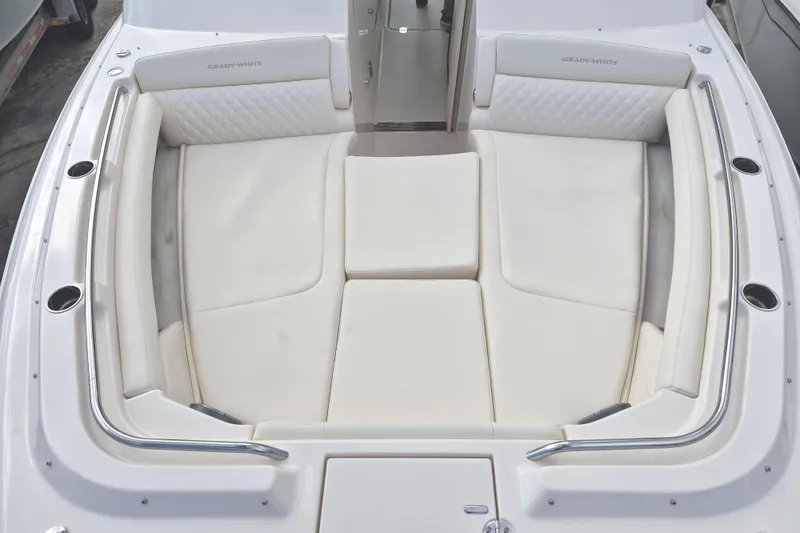 Slide: The Image of 2026 Grady-White Freedom 345 boat interior with white cushioned seating. - 9