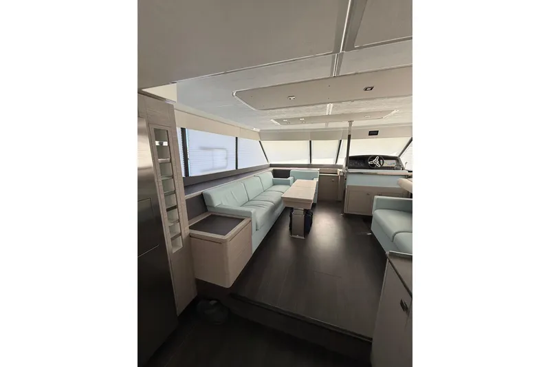 Slide: The Image of Luxurious interior of 2024 Fountaine Pajot MY 44 yacht with modern seating and helm. - 12