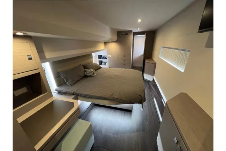 Slide: The Image of Luxurious bedroom interior of 2024 Fountaine Pajot MY 44 yacht, featuring modern design and cozy ambiance. - 18