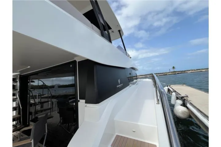 Slide: The Image of 2024 Fountaine Pajot MY 44 yacht docked, showcasing sleek design and modern features. - 21