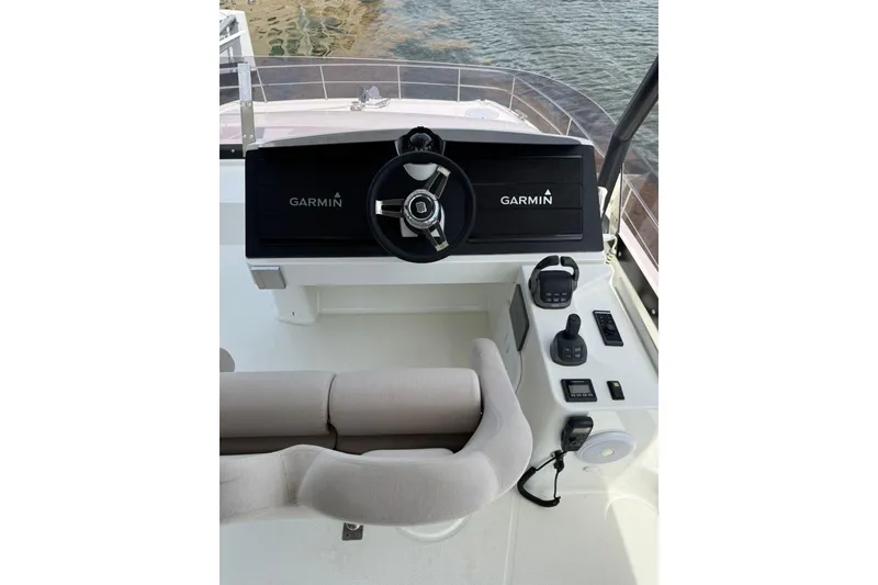 Slide: The Image of Helm of 2024 Fountaine Pajot MY6 yacht with Garmin navigation system and controls. - 34