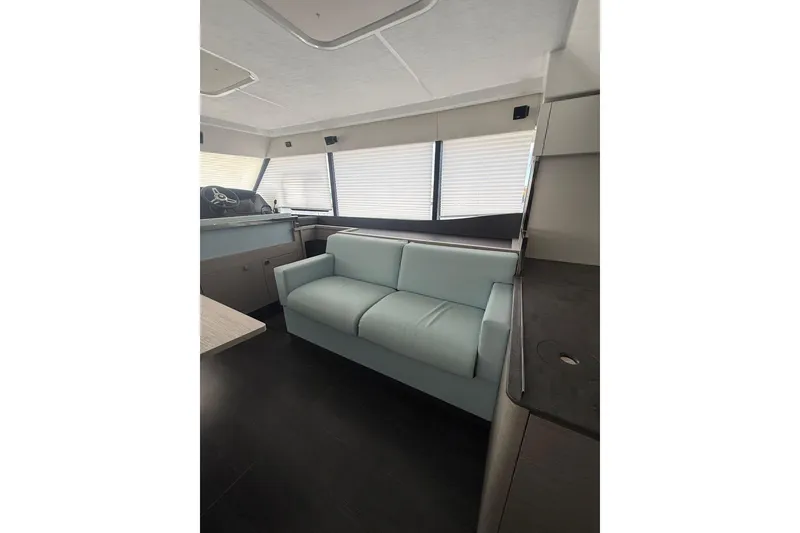 Slide: The Image of 2024 Fountaine Pajot MY6 yacht interior with modern seating and sleek design. - 36