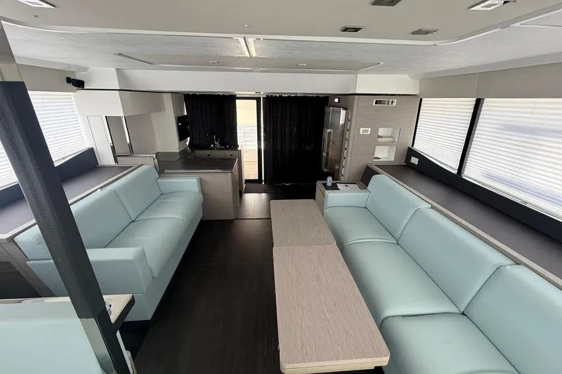 Slide: The Image of Luxurious interior of 2024 Fountaine Pajot MY6 yacht with modern seating and sleek design. - 37