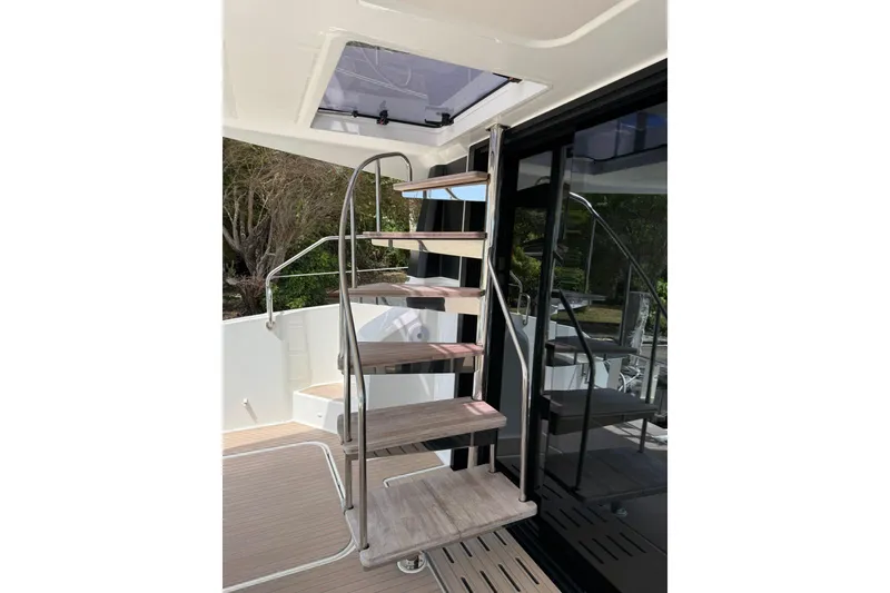 Slide: The Image of Modern spiral staircase on 2024 Fountaine Pajot MY6 yacht, featuring sleek design and wooden steps. - 39