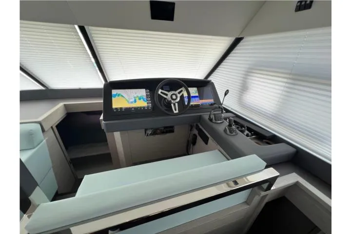 Slide: The Image of 2024 Fountaine Pajot Motor Yacht 44 docked, sleek design, sunny day, palm trees in background. - 4