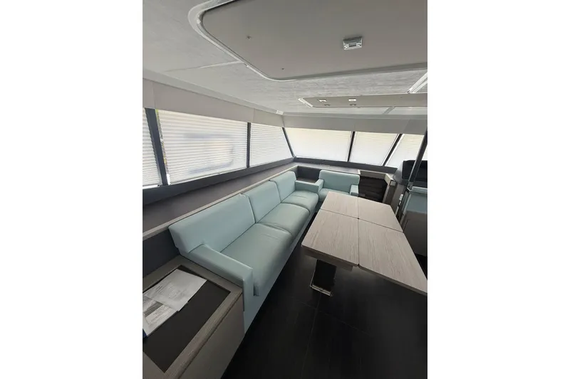 Slide: The Image of Luxurious interior of 2024 Fountaine Pajot MY6 yacht with modern seating and dining area. - 40