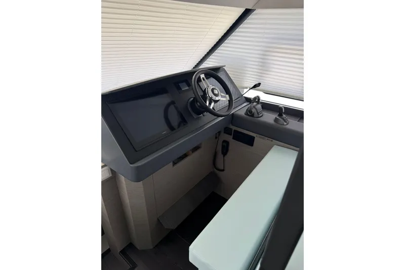 Slide: The Image of 2024 Fountaine Pajot MY6 helm with modern controls and sleek design. - 42