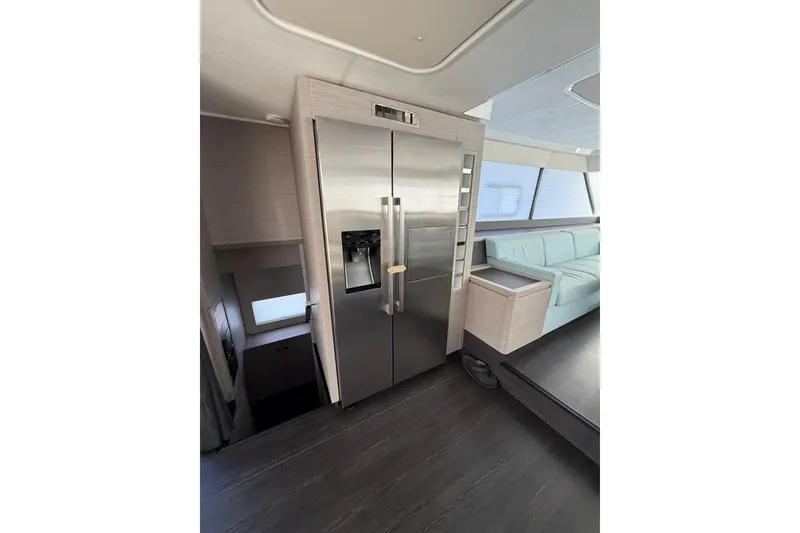 Slide: The Image of 2024 Fountaine Pajot Motor Yacht 44, sleek design, docked on calm water. - 8