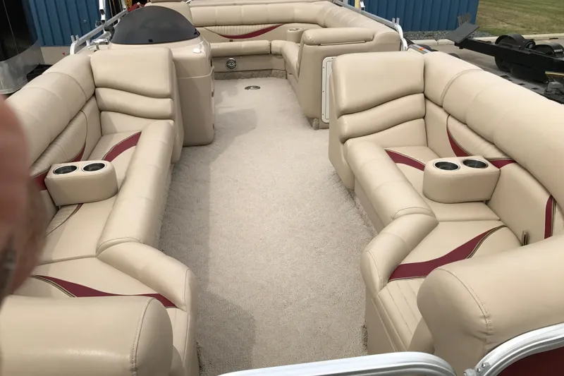 Slide: The Image of Luxurious interior of 2008 South Bay 822CR TT pontoon boat with beige seating and cup holders. - 12