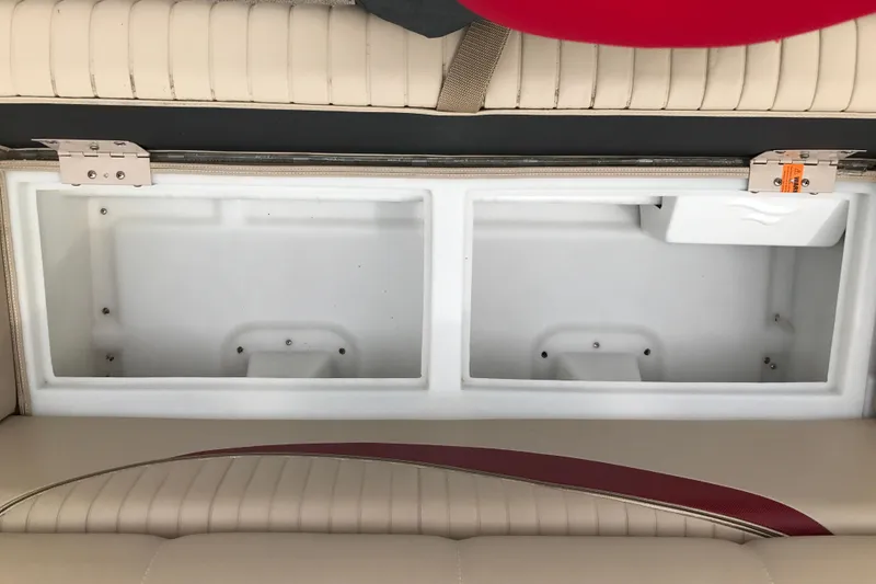 Slide: The Image of Open storage compartment in 2008 South Bay 822CR TT boat with beige seating. - 14