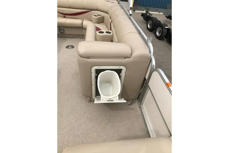 Slide: The Image of 2008 South Bay 822CR TT pontoon boat with beige seating and built-in storage compartment. - 15