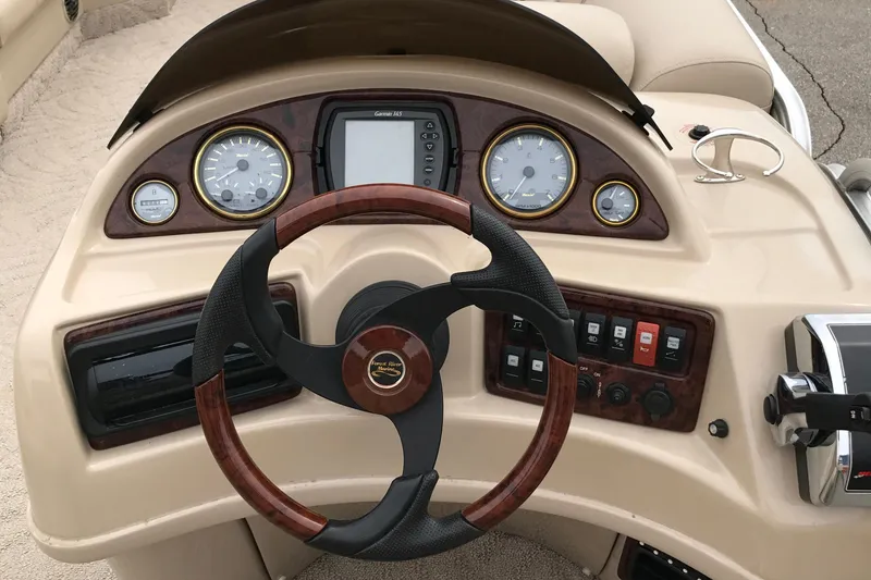 Slide: The Image of Steering console of 2008 South Bay 822CR TT boat with gauges and controls. - 6