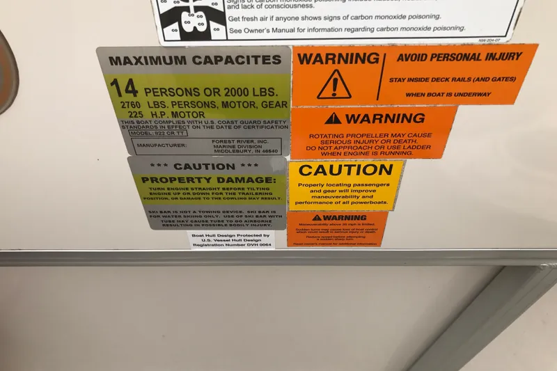 Slide: The Image of Safety and capacity warnings on a 2008 South Bay 822CR TT boat. - 9