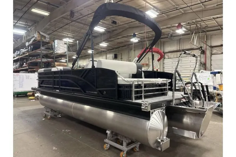 Slide: The Image of 2026 Bennington 22 SSB SwingBack Tritoon with Yamaha 150 Hp in warehouse setting. - 10