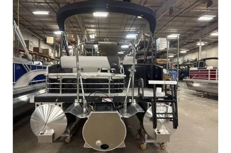 Slide: The Image of 2026 Bennington 22 SSB SwingBack Tritoon with Yamaha 150 Hp in warehouse setting. - 11