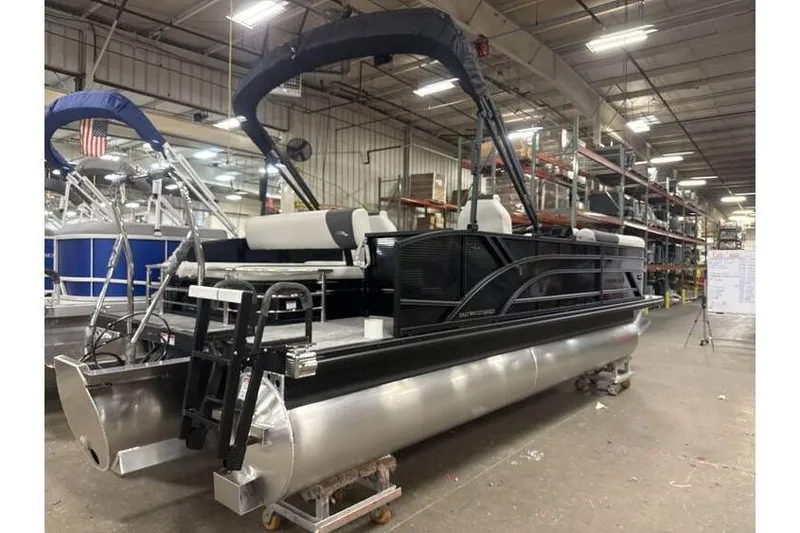 Slide: The Image of 2026 Bennington 22 SSB SwingBack Tritoon with Yamaha 150 Hp in stock, displayed indoors. - 12