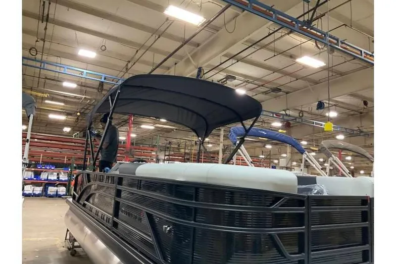 Slide: The Image of 2026 Bennington 22 SSB SwingBack Tritoon with Yamaha 150 Hp in warehouse setting. - 15