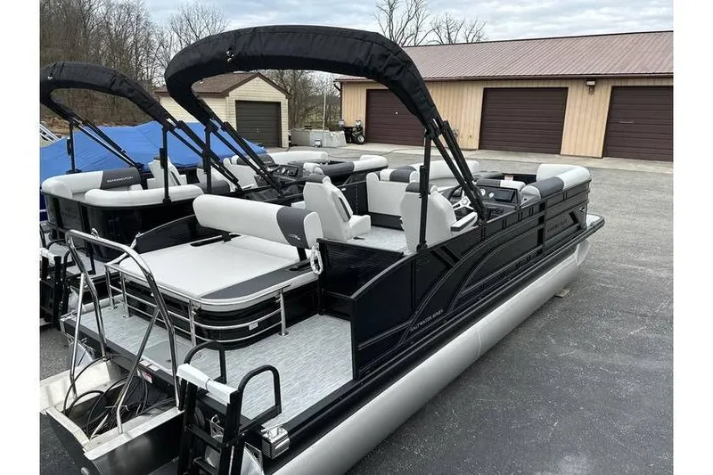 Slide: The Image of 2026 Bennington 22 SSB SwingBack Tritoon with Yamaha 150 Hp, parked outdoors. - 18