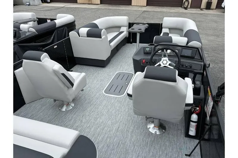 Slide: The Image of 2026 Bennington 22 SSB Tritoon interior with Yamaha 150 Hp, featuring plush seating and helm. - 19