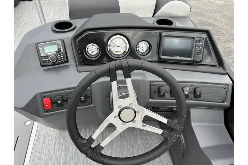 Slide: The Image of Steering console of 2026 Bennington 22 SSB Tritoon with Yamaha 150 Hp, featuring modern controls. - 26