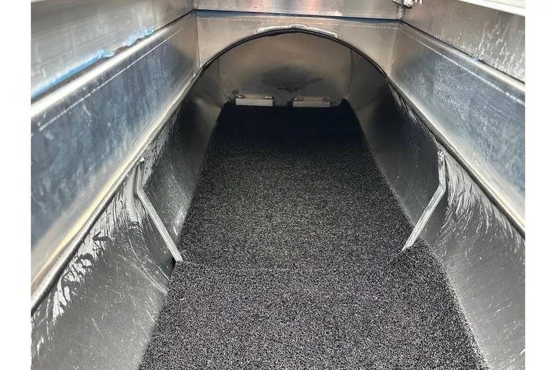 Slide: The Image of Interior view of Bennington 22 SSB SwingBack Tritoon, showcasing storage space. - 28