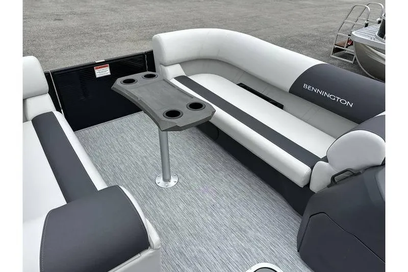 Slide: The Image of 2026 Bennington 22 SSB Tritoon interior with seating and table, featuring Yamaha 150 Hp engine. - 29