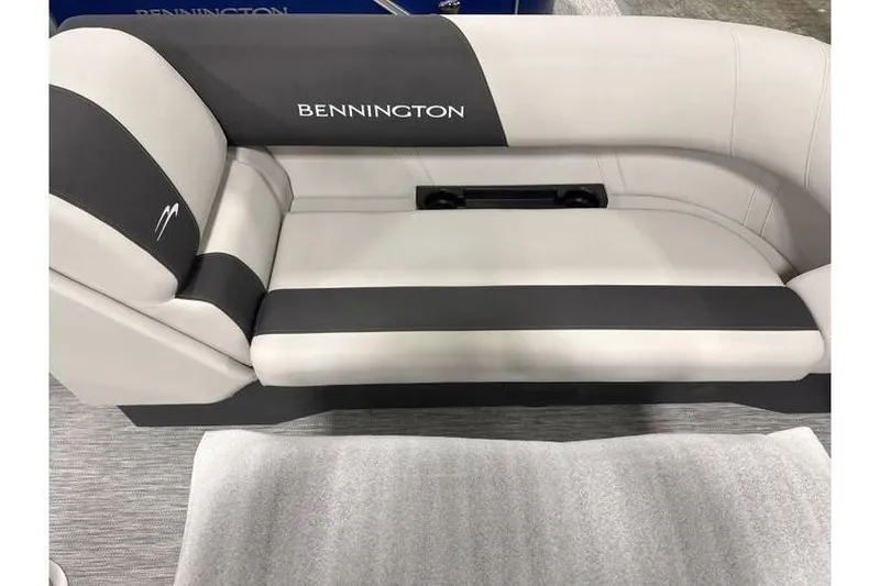 Slide: The Image of Bennington 22 SSB SwingBack Tritoon seating, 2026 model, featuring sleek gray upholstery. - 3