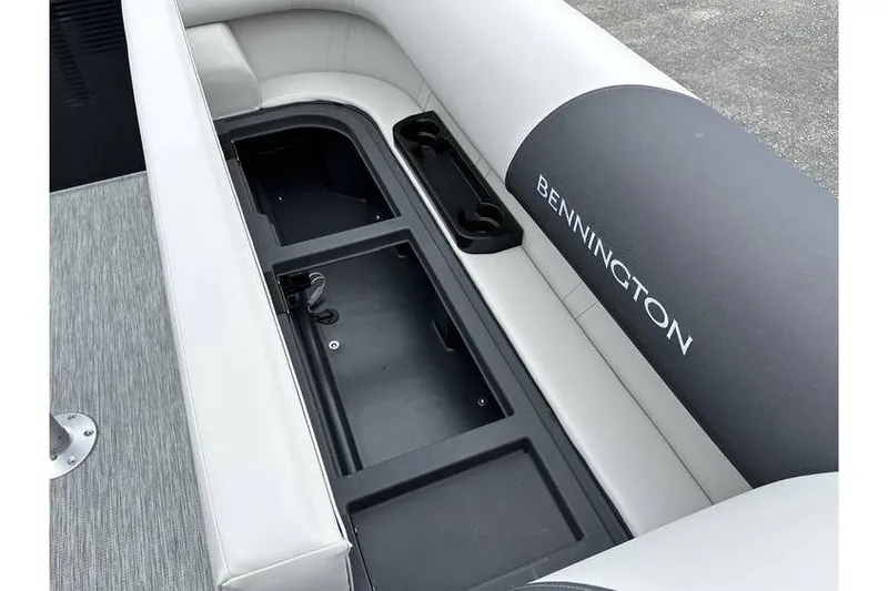 Slide: The Image of 2026 Bennington 22 SSB Tritoon interior seating with storage compartment. - 30