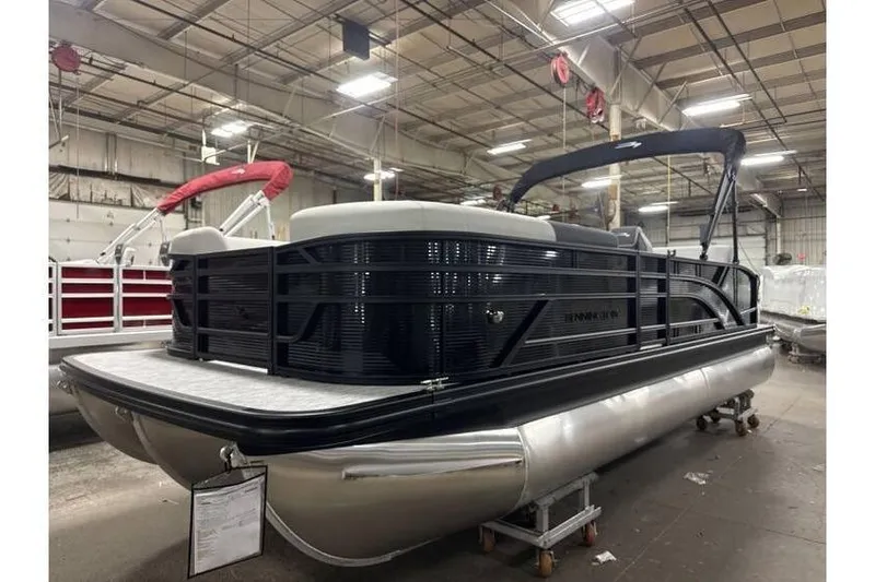 Slide: The Image of 2026 Bennington 22 SSB SwingBack Tritoon with Yamaha 150 Hp in stock, indoor display. - 4
