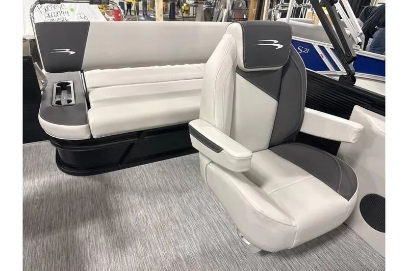 Slide: The Image of 2026 Bennington 22 SSB Tritoon interior with plush seating and modern design. - 6
