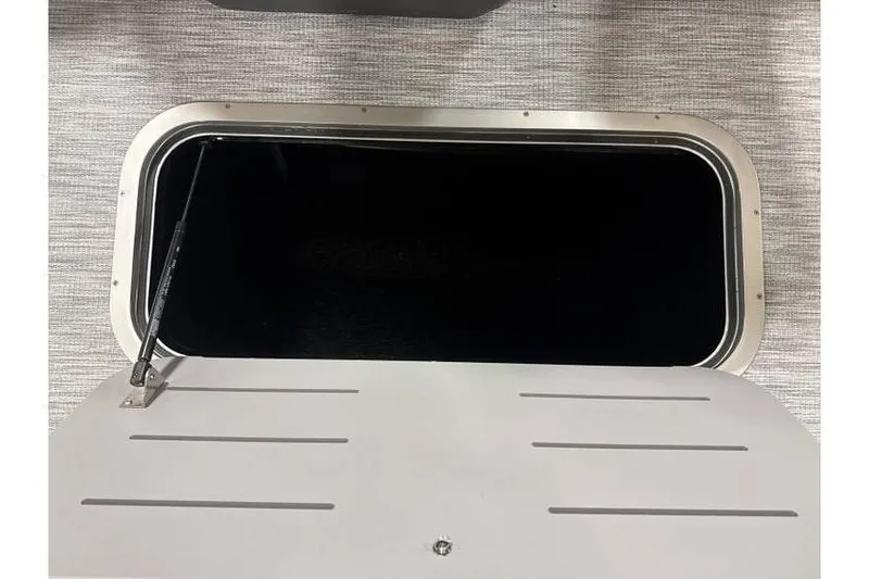 Slide: The Image of Storage compartment of 2026 Bennington 22 SSB SwingBack Tritoon with Yamaha 150 Hp. - 7