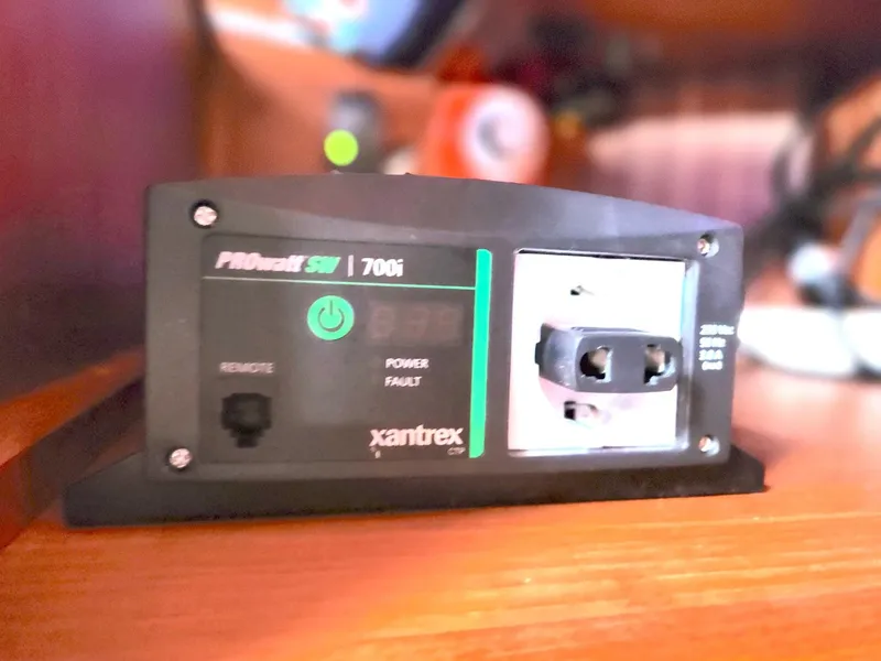 Slide: The Image of Xantrex PROsine 700i power inverter on a wooden surface, Granada 375 Atlantica, 1989. - 28