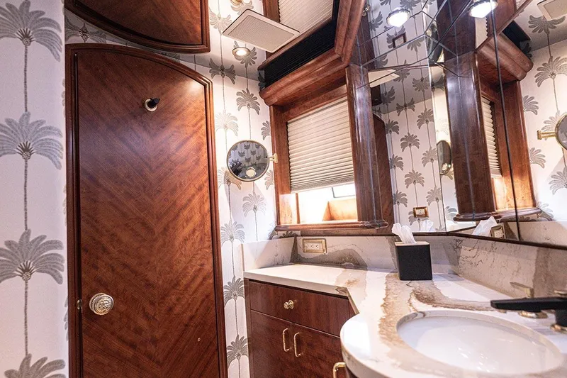 Slide: The Image of Luxurious bathroom on 2003 Cheoy Lee Trideck yacht with elegant wood and palm tree wallpaper. - 14