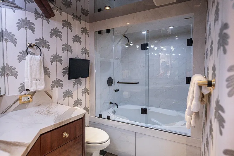 Slide: The Image of Luxurious Cheoy Lee Trideck 2003 yacht bathroom with elegant marble and palm tree wallpaper. - 15