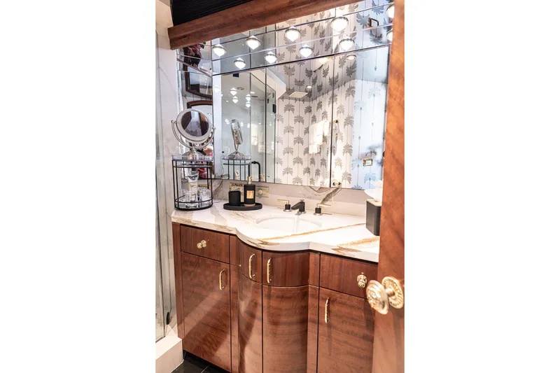 Slide: The Image of Luxurious Cheoy Lee Trideck 2003 yacht bathroom with elegant wood cabinetry and mirrored vanity. - 16