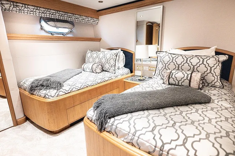 Slide: The Image of Luxurious twin cabin on 2003 Cheoy Lee Trideck yacht with elegant bedding and decor. - 22
