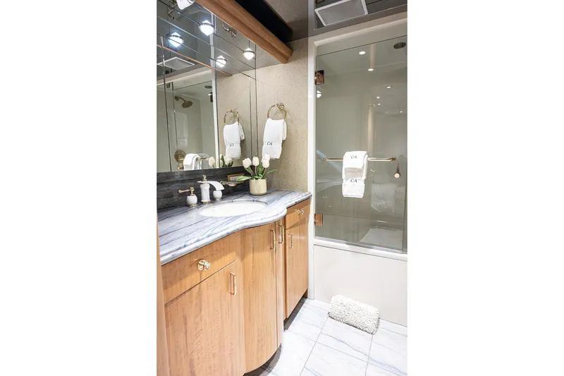 Slide: The Image of Luxurious bathroom in 2003 Cheoy Lee Trideck yacht with marble countertop and glass shower. - 23