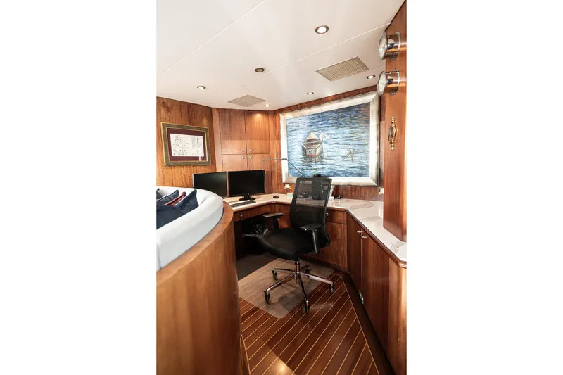 Slide: The Image of Luxurious Cheoy Lee Trideck 2003 yacht office with wood paneling and modern desk setup. - 26