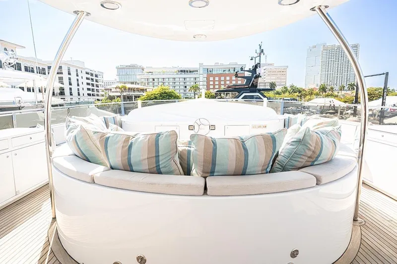 Slide: The Image of Luxurious 2003 Cheoy Lee Trideck yacht deck with plush seating and cityscape view. - 30