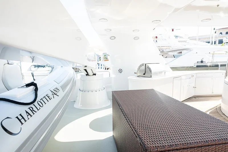 Slide: The Image of Luxurious 2003 Cheoy Lee Trideck yacht deck with seating and sleek design. - 32