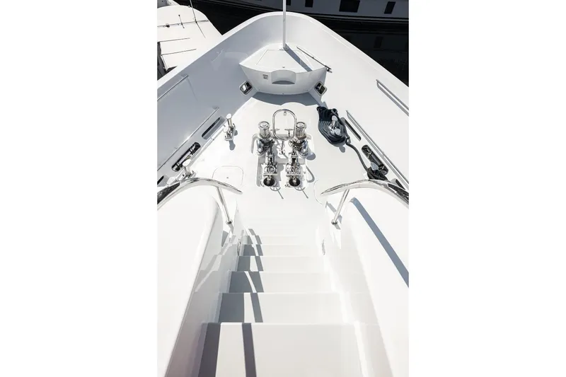 Slide: The Image of Staircase on 2003 Cheoy Lee Trideck yacht, featuring sleek white design and polished metal details. - 33