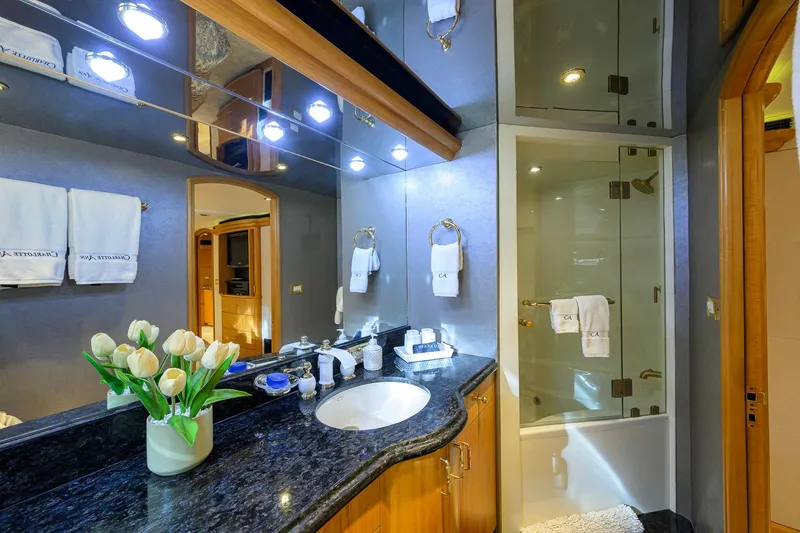 Slide: The Image of Luxurious bathroom on 2003 Cheoy Lee Trideck yacht with elegant fixtures and fresh tulips. - 35