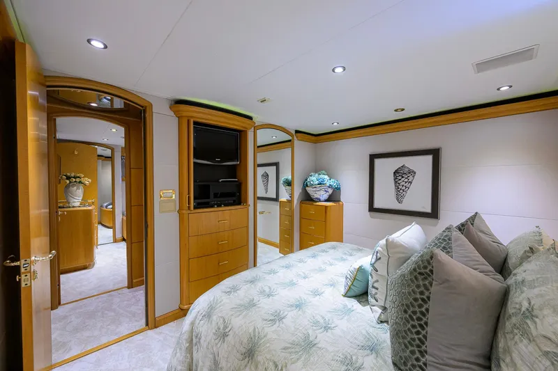 Slide: The Image of Luxurious bedroom interior on 2003 Cheoy Lee Trideck yacht, featuring elegant decor and cozy bedding. - 37