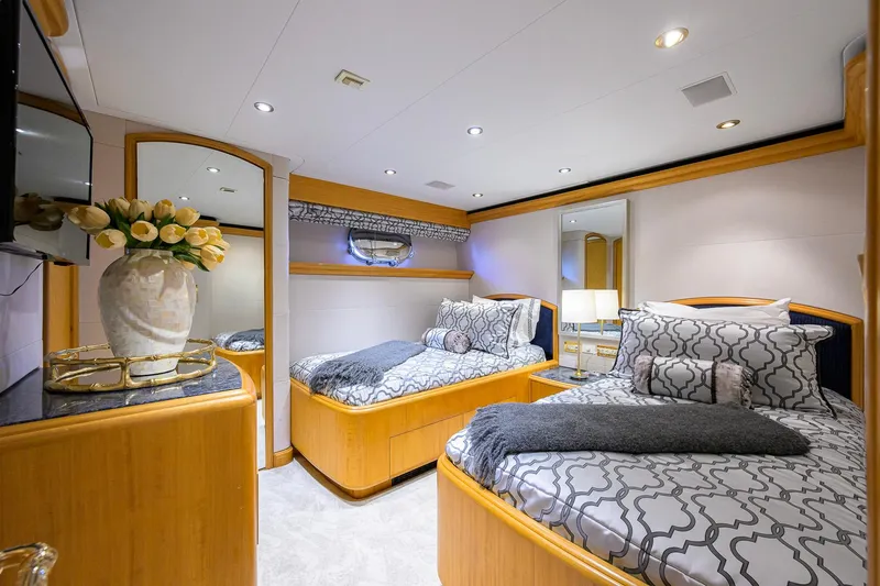 Slide: The Image of Luxurious 2003 Cheoy Lee Trideck yacht bedroom with twin beds and elegant decor. - 39