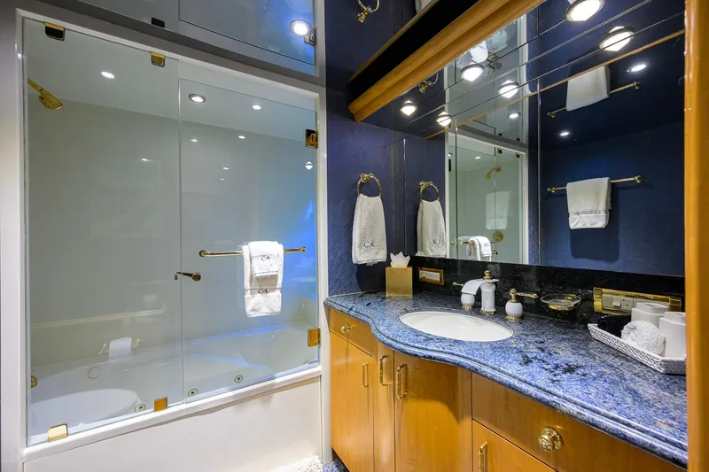 Slide: The Image of Luxurious bathroom on 2003 Cheoy Lee Trideck yacht with elegant fixtures and blue granite countertop. - 41