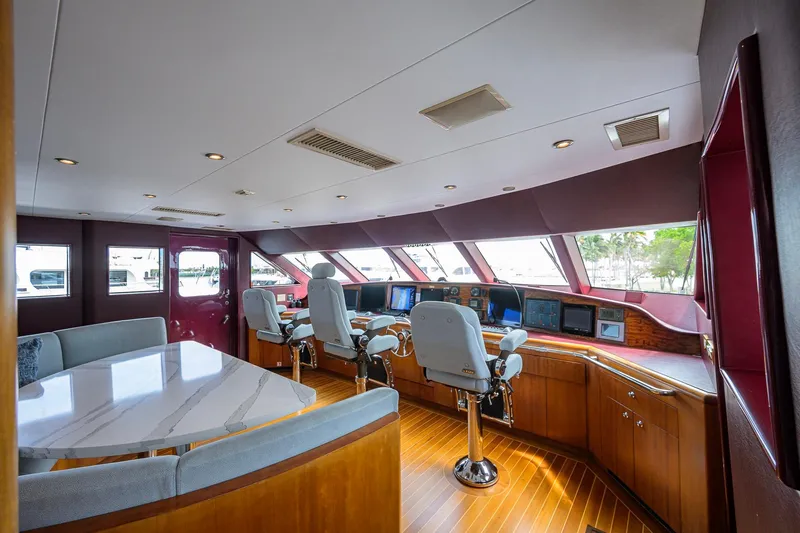 Slide: The Image of Luxurious 2003 Cheoy Lee Trideck yacht helm with modern navigation equipment and elegant seating. - 43