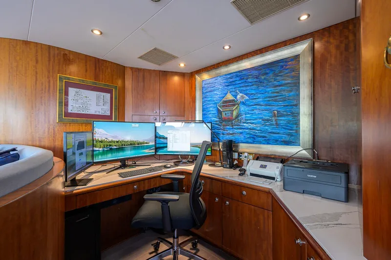 Slide: The Image of Luxurious yacht office with dual monitors, wooden cabinetry, and nautical artwork on Cheoy Lee Trideck 2003. - 46