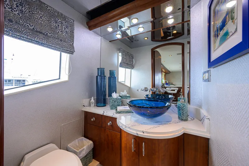 Slide: The Image of Luxurious 2003 Cheoy Lee Trideck yacht bathroom with elegant blue glass sink and modern decor. - 49
